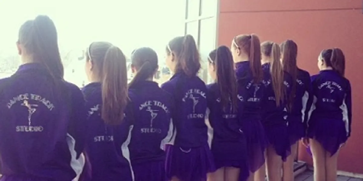 A group of young girls in purple uniforms.